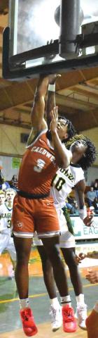 TRE BURNS of Caldwell takes a shot against Lexington. Caldwell won 57-48.