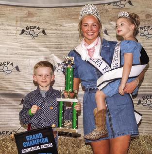 JOSEPH CHARANZA exhibited the Grand Champion Commercial Heifers at this year’s Burleson County Fair. He is pictured with Burleson County Fair Queen Hadleigh Novosad and Little Miss Avery Freeman.
