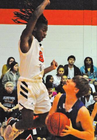 SNOOK’S SAM Smitherman gets ready to shoot as Somerville’s Hershel Conway defends. -- Tribune photo by Denise Squier