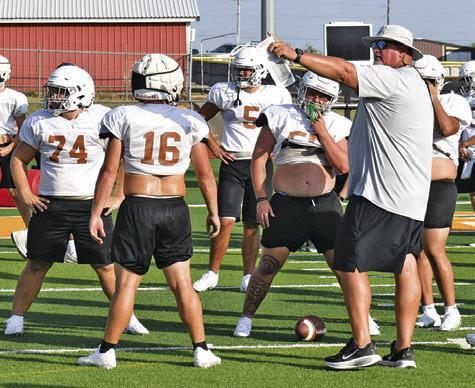 CALDWELL HEAD COACH Sean Witherwax talks to his players during a Monday, Aug. 24, workout at Hornet Stadium. Tribune photo by Roy Sanders