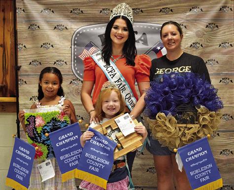 IVEY LEWIS WON GRANDS IN Children’s Corner Canned Foods, Creative Arts and Crafts and Needlework, and Hannah Kovar won grand in Adult Creative Arts and Crafts. Also pictured are Fair Queen Kodi Hitchcock and Little Miss Taytum Hohlt. Tribune photo by Sabine Lazo