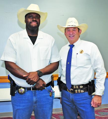 JEROME PLAIR is joined by Sheriff Bill Rios at his swearing in ceremony on Monday.