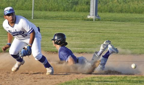 SNOOK’S JACOB CASTANEDA watches the ball as this Mumford base runner slides into second base in last Friday’s game. -- Tribune photo by Roy Sanders