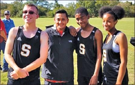 SOMERVILLE’S JARET PINKERTON, Javen Henderson and Ra-Maya Carter ran at the UIL Class 2A Region 4 Cross Country Meet on Monday. They are pictured with Running Yeguas’ coach Billy Ramey.