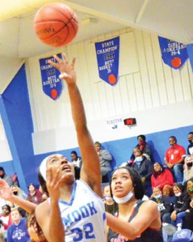 JAIVAN STRINGFELLOW shoots the ball while Mexia’s Jenny Williams looks on during the Lady Jays’ win over Mexia last Friday.