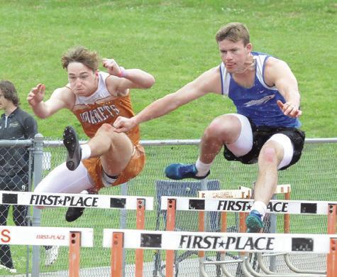 CALDWELL’S BRAXTON FRITCHER leaps over a hurdle during last week’s Happy Skrabanek Relays. -- Tribune photo by Denise Squier