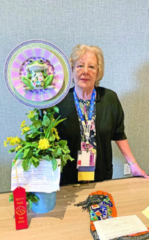 CLAUDIE PITMAN of Lyons EEA won second place at the state conference for yard art.