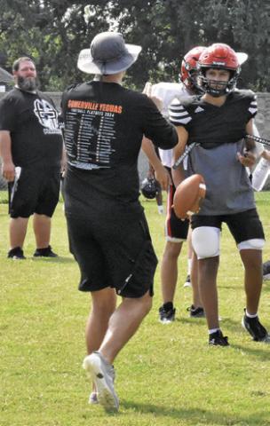 NEW SOMERVILLE Head Coach Luke Klingler talks to his players during a practice session.