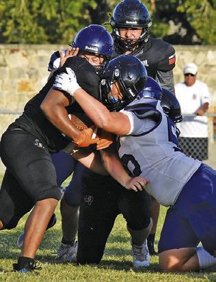 SOMERVILLE FIGHTS FOR some tough yardage against Leon last Friday, Aug. 14, in a scrimmage in Somerville. Tribune photo by Roy Sanders