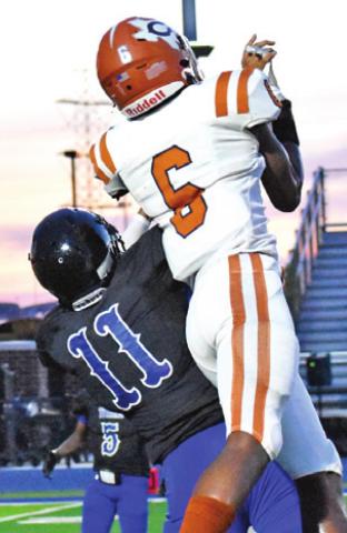 CALDWELL’S TRE Burns goes for the ball. -- Tribune photo by Roy Sanders