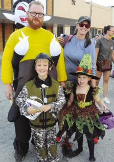 THE EVANS FAMILY was dressed in costume, enjoying Saturday’s Scare on the Square. (And, yes, Samantha is in costume...as “Mom.”) Tribune photo by Denise Squier