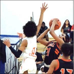 SOMERVILLE’S XADRIA Martin tries to shoot over Caldwell’s Ja’Asia Mathis during their game Saturday afternoon in Caldwell.