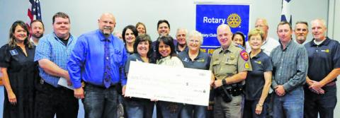 THE CALDWELL ROTARY CLUB donated $10,000 to local law enforcement agencies during its meeting on Tuesday, July 30, at the Caldwell Civic Center. Money raised during the organization’s annual Law Enforcement Appreciation Banquet was included in this donation. Tribune photo by Denise Squier