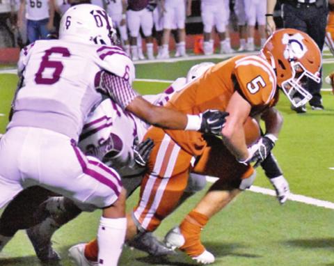 CALDWELL’S JACE ALY fights for extra yards against Cameron.