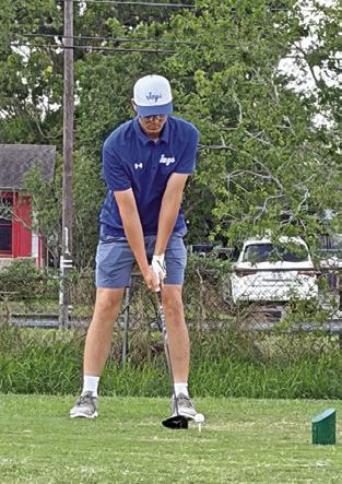 ALBERTO NORWOOD prepares to tee off for Snook at the regional golf tournament.