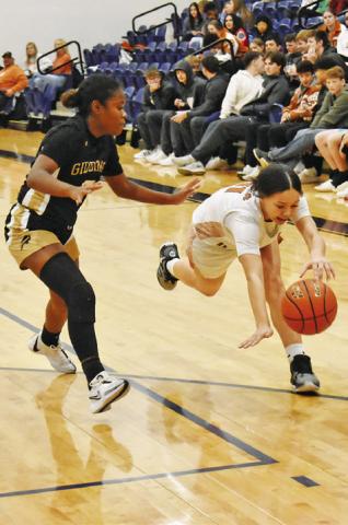 CALDWELL’S CHASSIDY ROGERS chases down the ball during the Lady Hornets’ 50-36 home loss to Giddings on Friday.