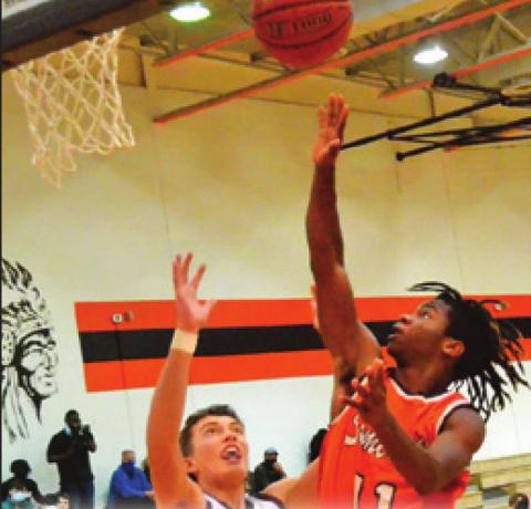 SOMERVILLE’S HERSCHEL Conway takes a shot last Friday against Milano. The Yeguas won 53-52. -- Tribune photo by Roy Sanders