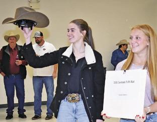 MARY HANCOCK and Caitlyn Faust display these auction items at the 2025 Burleson County Go Texan annual fundraiser. This year’s event is set for this Saturday, Feb. 7.