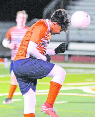 JOSE ALVARES HEADS the ball during Caldwell’s win over Smithville last Friday night.