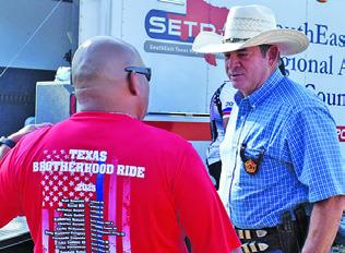 BURLESON COUNTY Sheriff Bill Rios greets a member of the Texas Brotherhood Ride on Thursday, Sept. 11, in Caldwell.