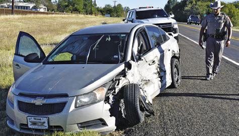 A DPS TROOPER investigates at the scene of this accident on Oct. 30 on State Highway 36 North near County Road 314.