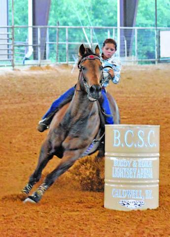 GIULIANA SCARMARDO COMPETES in the 9U Straight Barrels at the Burleson County Saddle Club Youth Rodeo in Caldwell.