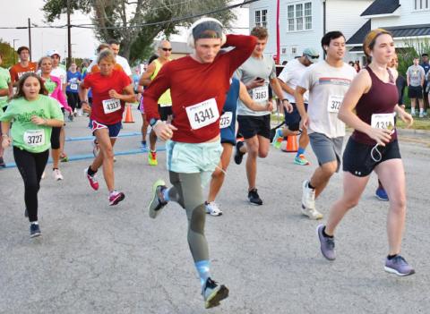 CALDWELL’S GARRETT SCOTT (bib number 4341) and runners from across Texas run in last Saturday’s Kolache Krunch 5K. Scott finished second in the male 15-19 division. -- Tribune photo by Roy Sanders