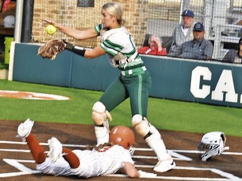 CALDWELL’S AVERY SMITH slides into home during the Lady Hornets’ warm-up game against Latexo last Friday night.