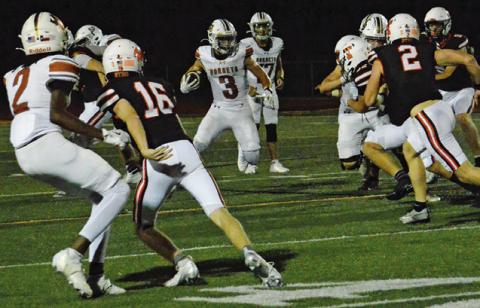 COY BECKA OF Caldwell runs with the ball against Smithville in a 49-34 victory. Tribune photo by Sabine Lazo