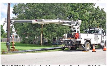 THIS NATURAL GAS line break is repaired on Tuesday on Eighth Street between O’Neal and Banks streets. Tribune photo by Roy Sanders