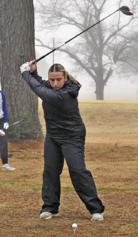 TANZLEY JOHNSON tees off at the Lexington Tournament in Caldwell.