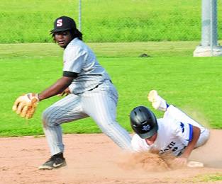 RAIJOIN SHIVERS of Somerville gets ready to throw the ball as Snook’s Brett Withem slides into base. Snook won the game 8-7. Tribune photo by Roy Sanders