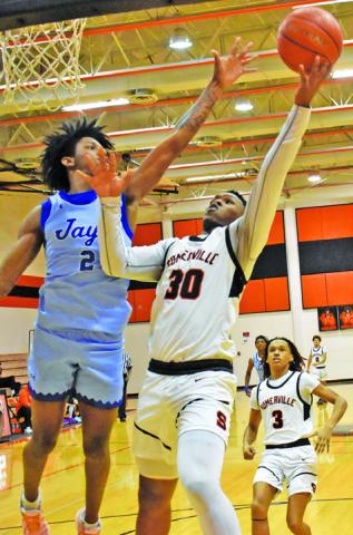 JA’KEITH DANIELS of Somerville takes a shot as Snook’s Jimmy Kearney tries to block the shot. Snook won 42-39. Tribune photo by Roy Sanders