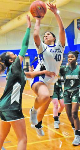 SNOOK’S KARLA LARA takes a jump shot over a Normangee player during Snook’s 50-34 win last Friday evening in Snook. Tribune photo by Roy Sanders
