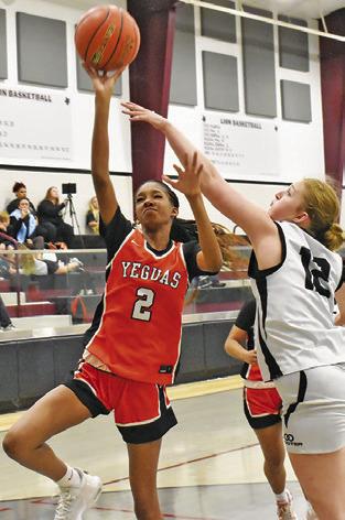 KARYS ELLIS TAKES a shot while a Cornerstone Christian Academy player defends during the Fayetteville Tournament last week. Tribune photo by Roy Sanders