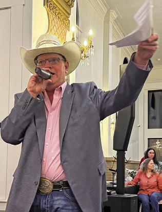 JOHN GRANGE acts as auctioneer at last Thursday’s Burleson County Chamber of Commerce Banquet at The Novo in Caldwell. Tribune photo by Denise Squier