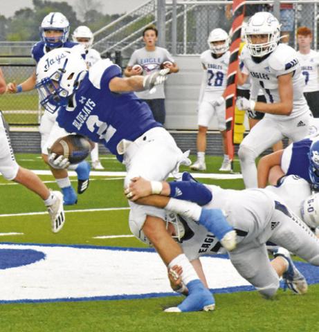 LANCE LARA OF Snook carries the ball against Brazos Christian last Friday in Snook. -- Tribune photo by Roy Sanders