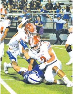 BLANE GARZA OF Caldwell makes a tackle last Friday against the Jarrell Cougars. -- Tribune photo by Kim Hutcheson