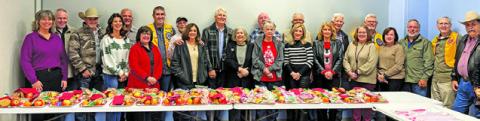 THE CALDWELL MEN’S LIONS CLUB held its Christmas dinner, inviting spouses and significant others, and then wrapping cookie and fruit plates to hand out to widows and widowers in the area. At the event, the club prepared 32 plates.