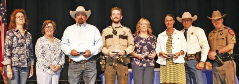 BURLESON COUNTY LAW OFFICER award winners included, third from the left, Chad Elkins, Steven O’Shaughnessy, Ginger Rogers and Nicole Colley. Joining them were, far left, Rotary Incoming President Tracy Pieper and President Lia Zaccagnino, and far right, Sheriff Bill Rios and DPS Sgt. Justin Stohler.