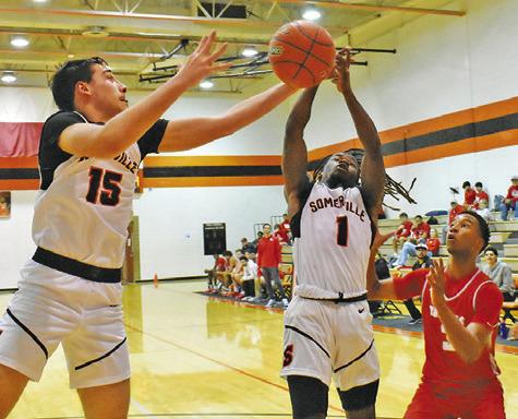 SOMERVILLE’S HERSCHEL CONWAY and Irman Sadic fight fight for the ball against Bellville. -- Tribune photo by Roy Sanders