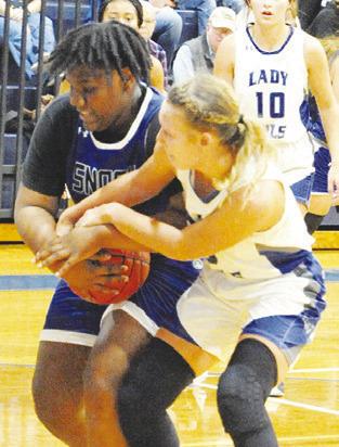 SNOOK’S MYKIA MUNSON FIGHTS with an Anderson-Shiro player for possession of the ball.