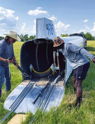 A GLIDER IS placed into this trailer and removed after an emergency landing on Aug. 5 off County Road 130. See story and additional photo inside.
