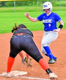 AUBREY KOVASOVIC prepares to tag Snook runner Heidi Janac during the Somerville-Snook game last Friday in Snook. Tribune photo by Roy Sanders
