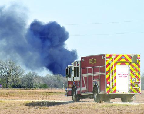 A FIRE TRUCK responds to the oil well fire site off F.M. 2000. Tribune photo by Roy Sanders