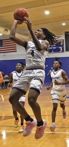 JOHN CARR of Snook takes a shot against St. Paul last Friday in Snook. Tribune photo by Roy Sanders