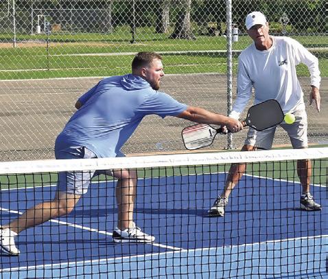 PICKLEBALL PLAYERS INCLUDING Dusty Lowe, right, enjoy Caldwell’s first pickelball tournament on Saturday at John E. Hejl Park. -- Tribune photo by Roy Sanders