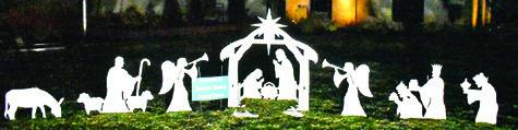 THIS NATIVITY SCENE by the Cowboy Church in Caldwell is displayed on the lawn of the Burleson County Courthouse in Caldwell. Passersby are enjoying the downtown decorations.