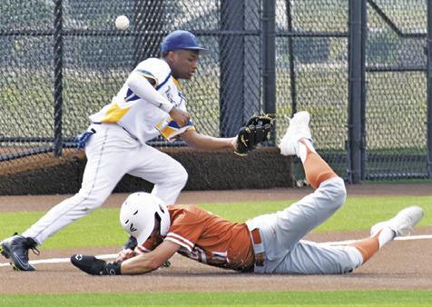COY BECKA OF Caldwell slides into base against Houston Washington in the bi-district game.
