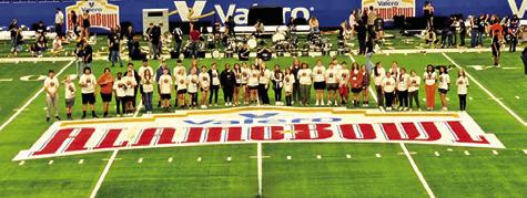 THE CALDWELL HIGH SCHOOL Marching Band poses on the Alamodome field ahead of rehearsal. Photo courtesy of Dr. Jason Levin
